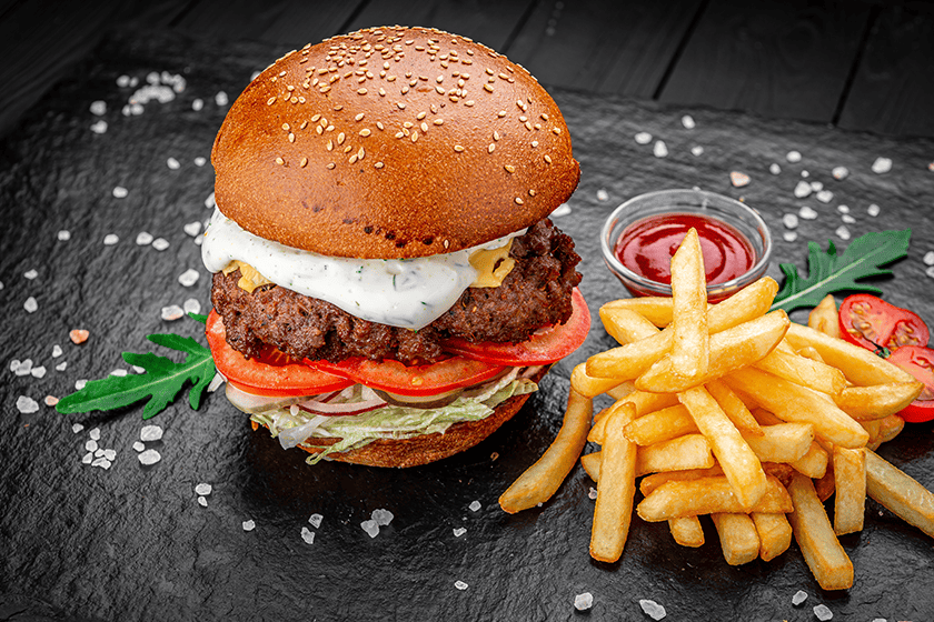 An american burger with fried potatoes