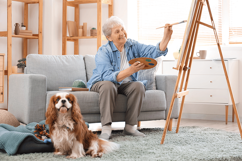 Senior woman with cute cavalier King Charles