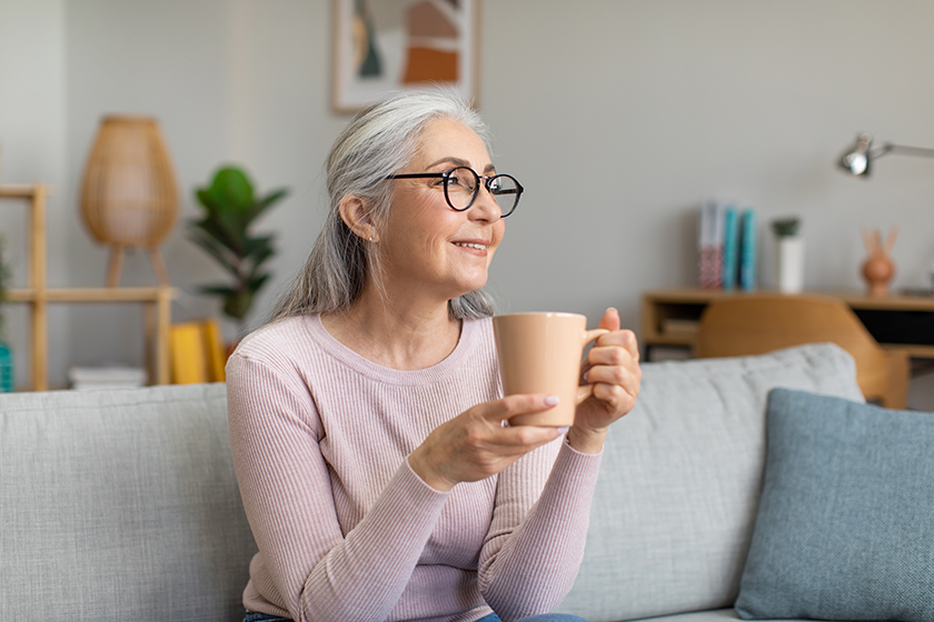 Smiling pretty caucasian aged gray-haired woman
