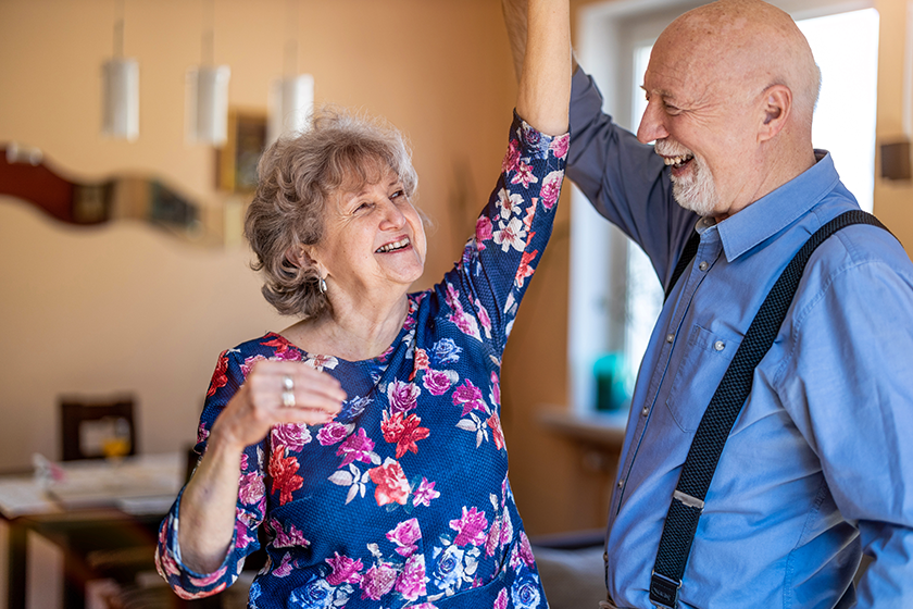 happy-senior-couple-dancing-together